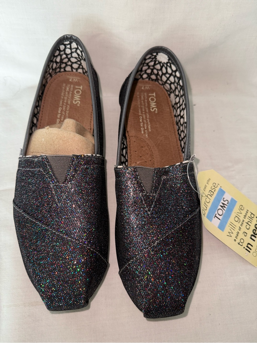 NWT Toms Black Multicolor Glitter Slip-On Flats Size 7, w/Dust Bag